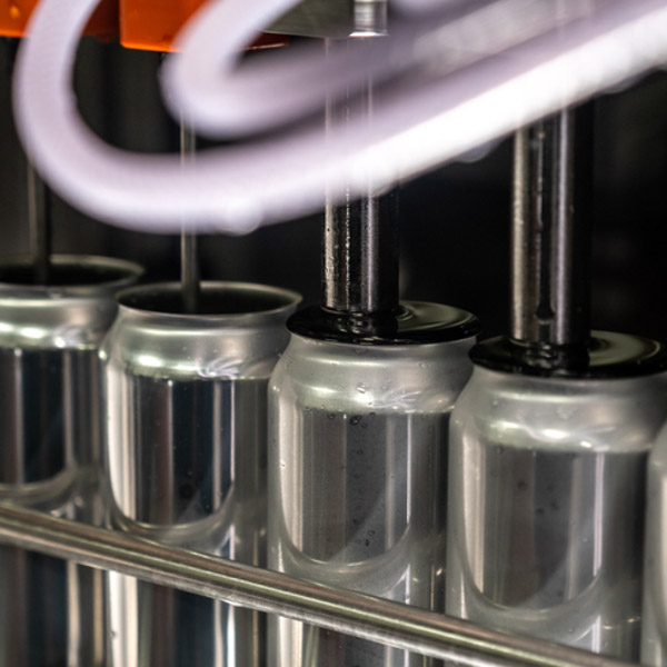 Beer cans on a canning machine